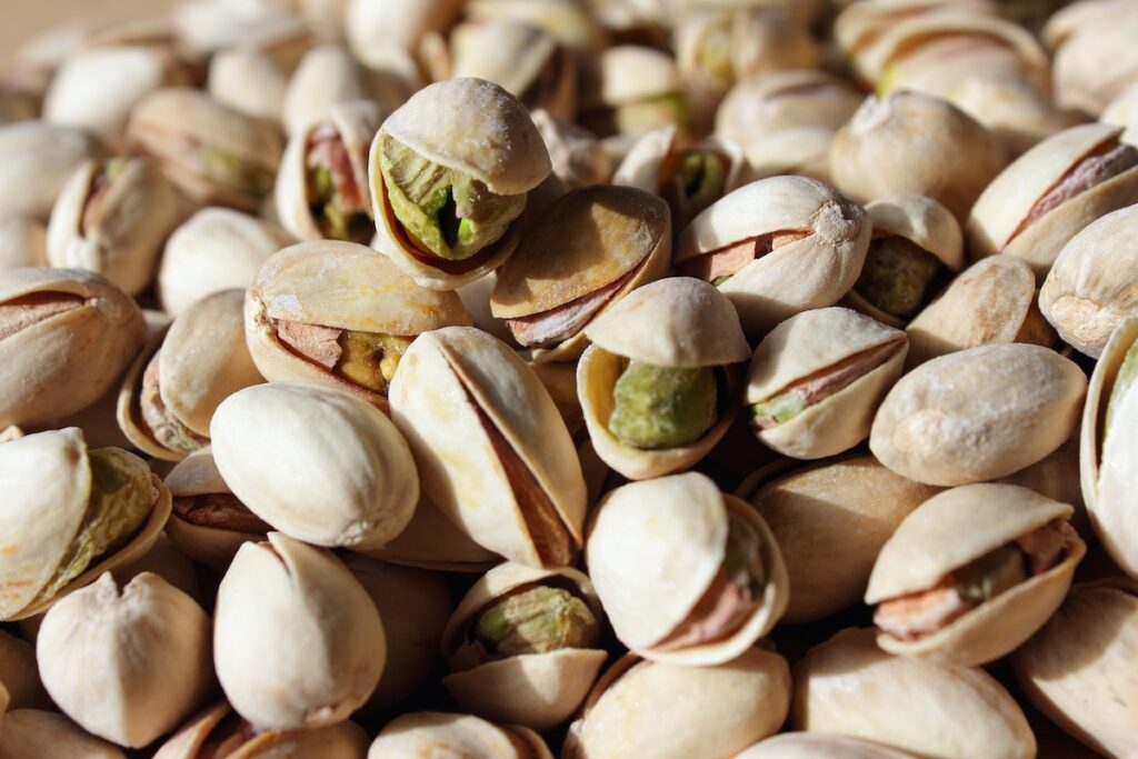 A background of pistachio nuts.