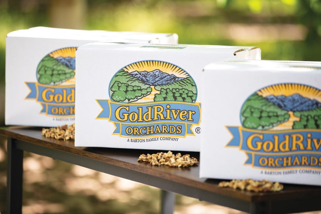 Three white boxes that each have the GoldRiver Orchards logo.