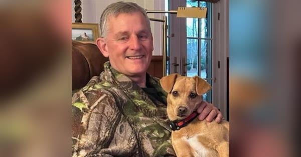 Chop Evans holding his dog.