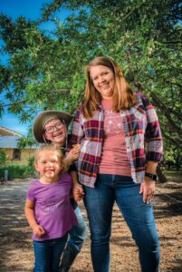 Jenny Holtermann, her daughter and son smile for the camera.