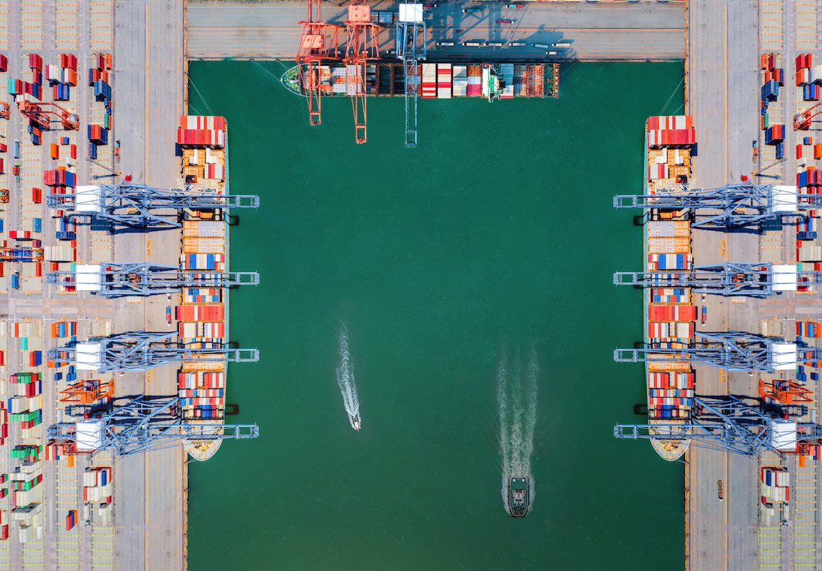 Aerial view of shipping port with cargo containers.