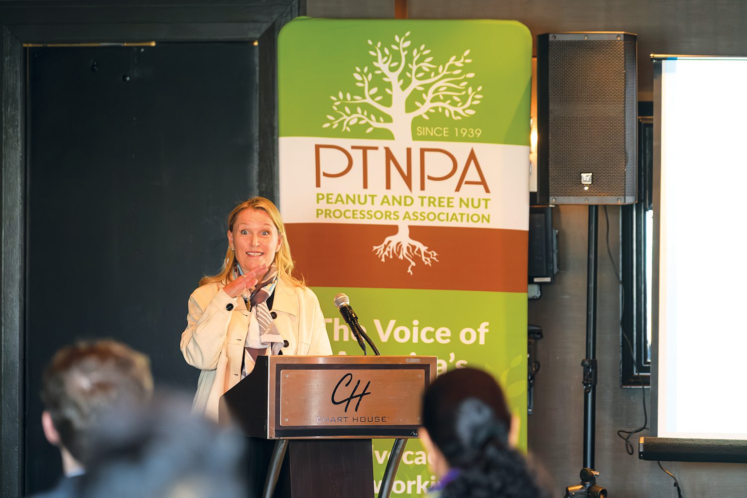 woman at podium of PTNPA event