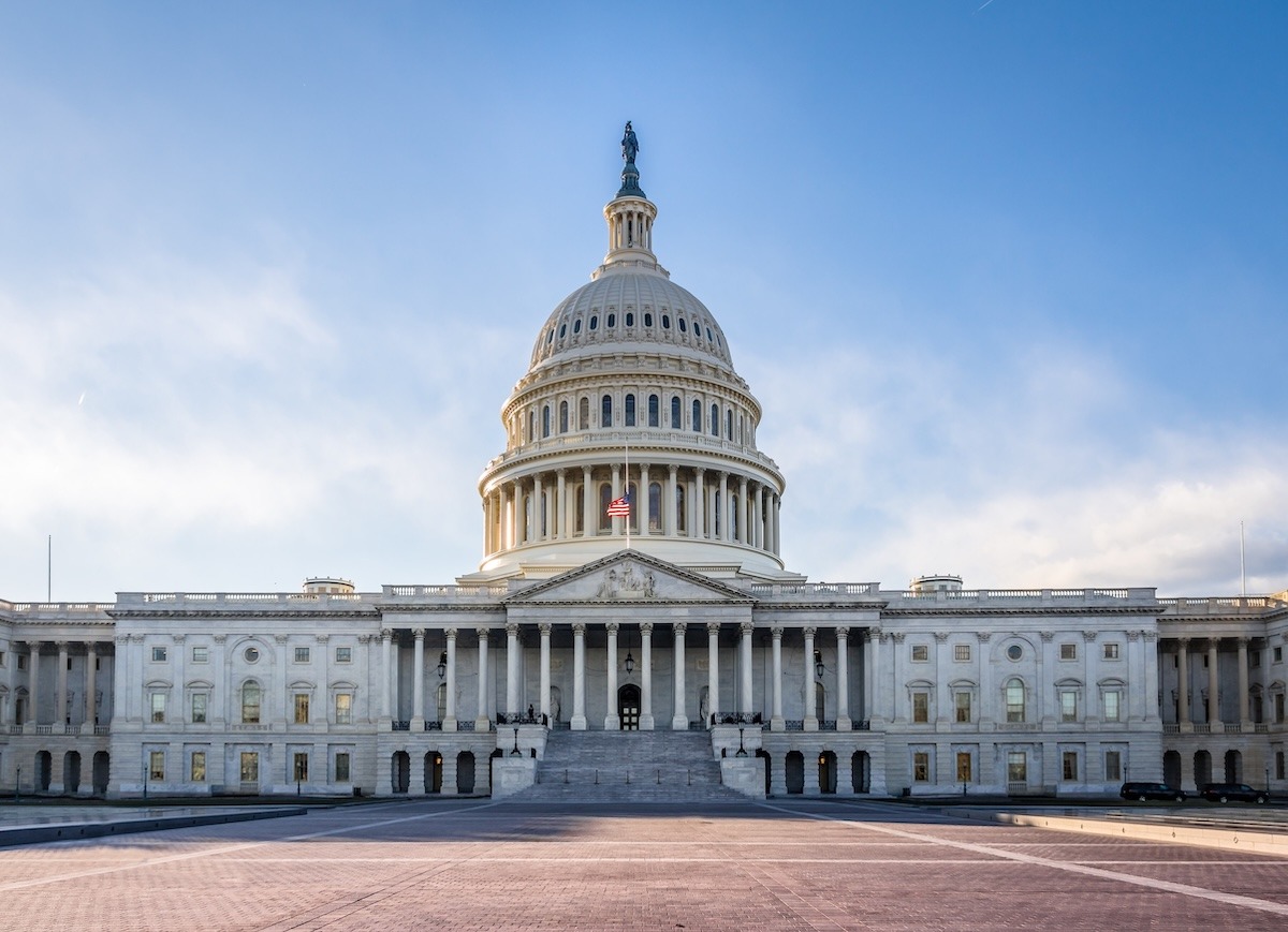 The U.S. Capitol outlined against a blue sky