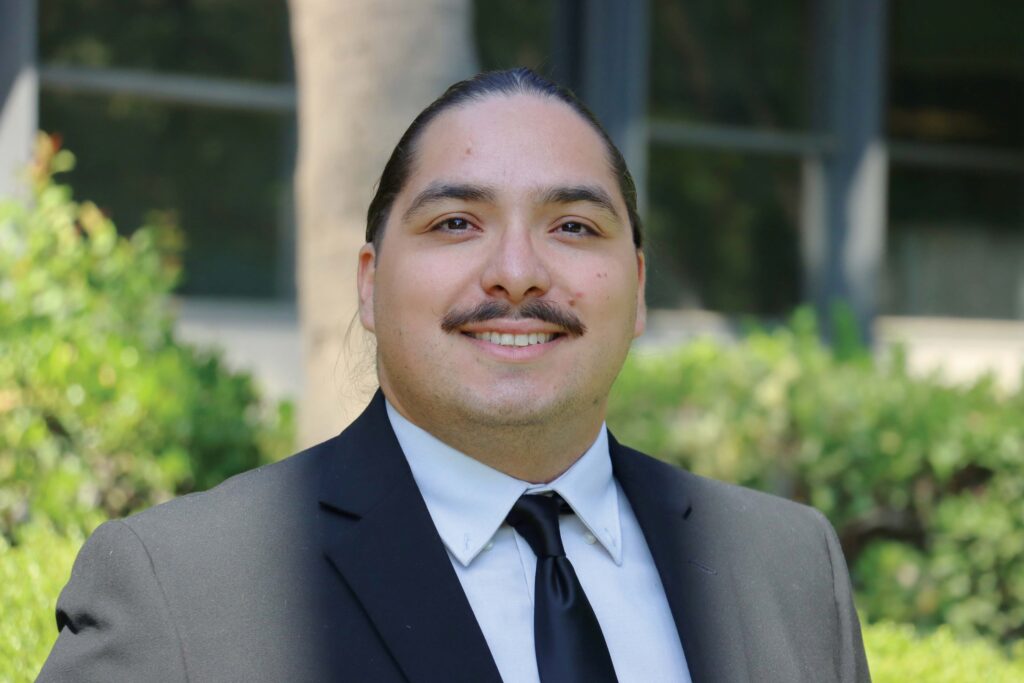 headshot of man in suit